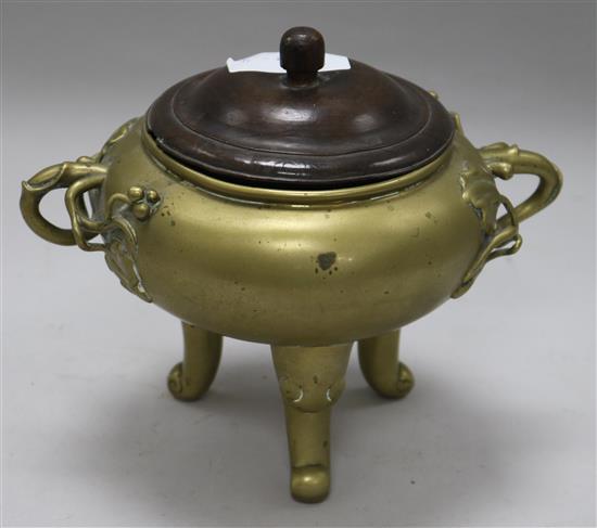 A Chinese bronze censer, wood cover